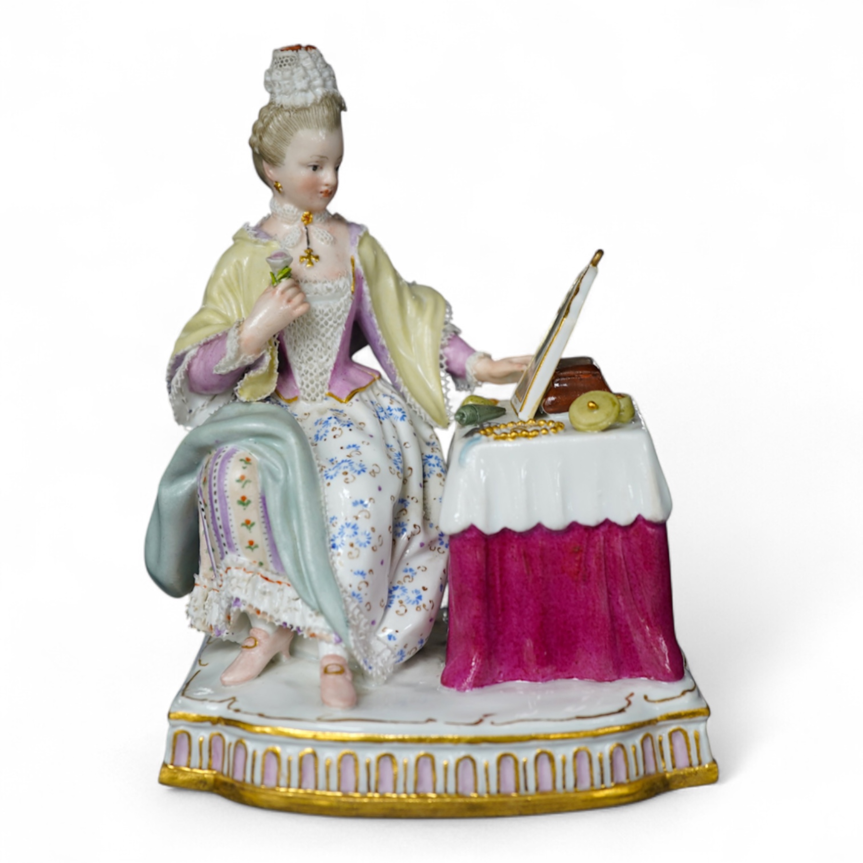 A late 19th century Meissen figure of Sight, from the Senses, a seated lady at her dressing table, crossed swords mark and incised E3 mark to base, 14cm high